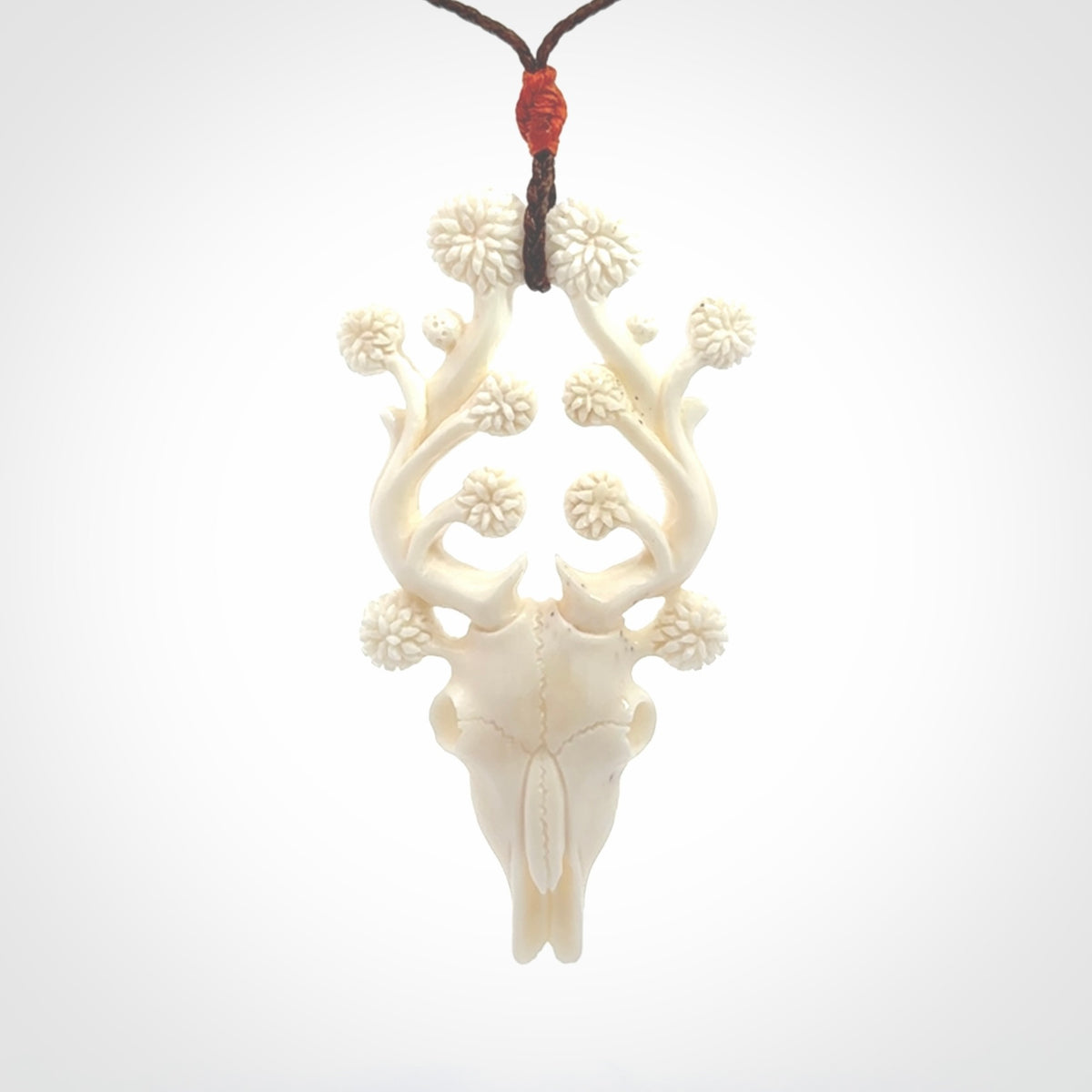 This is a hand carved contemporary bison bone skull pendant. This is a medium sized necklace and is a very unique pendant that is a piece for bison lovers.