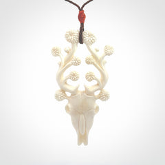 This is a hand carved contemporary bison bone skull pendant. This is a medium sized necklace and is a very unique pendant that is a piece for bison lovers.