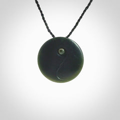 This is a hand carved Black Jade drop pendant with New Zealand Jade insert. This is a smaller sized necklace and is provided with an adjustable black cord.