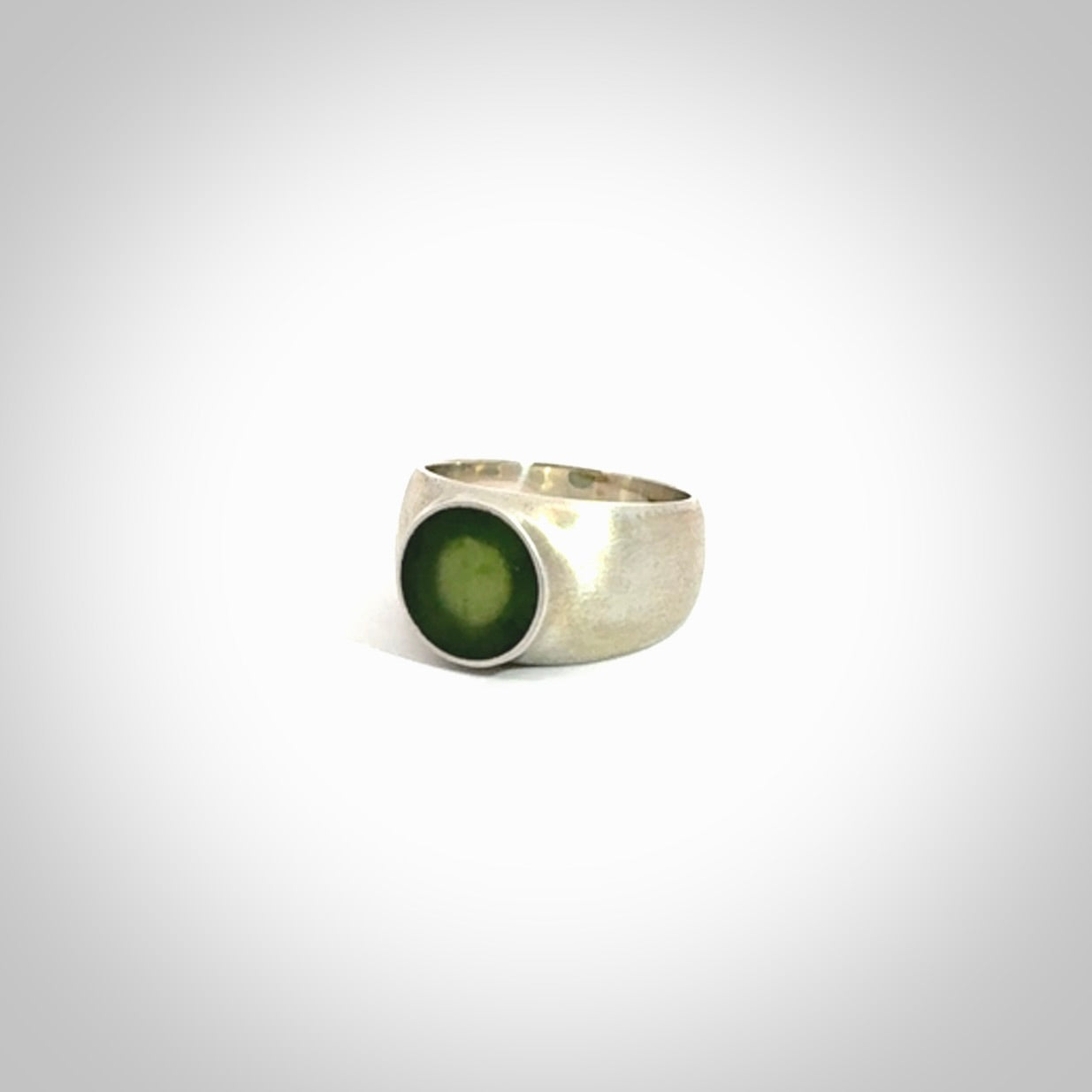 Hand carved jade band ring with sterling silver.