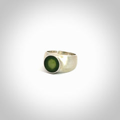 Hand carved jade band ring with sterling silver.