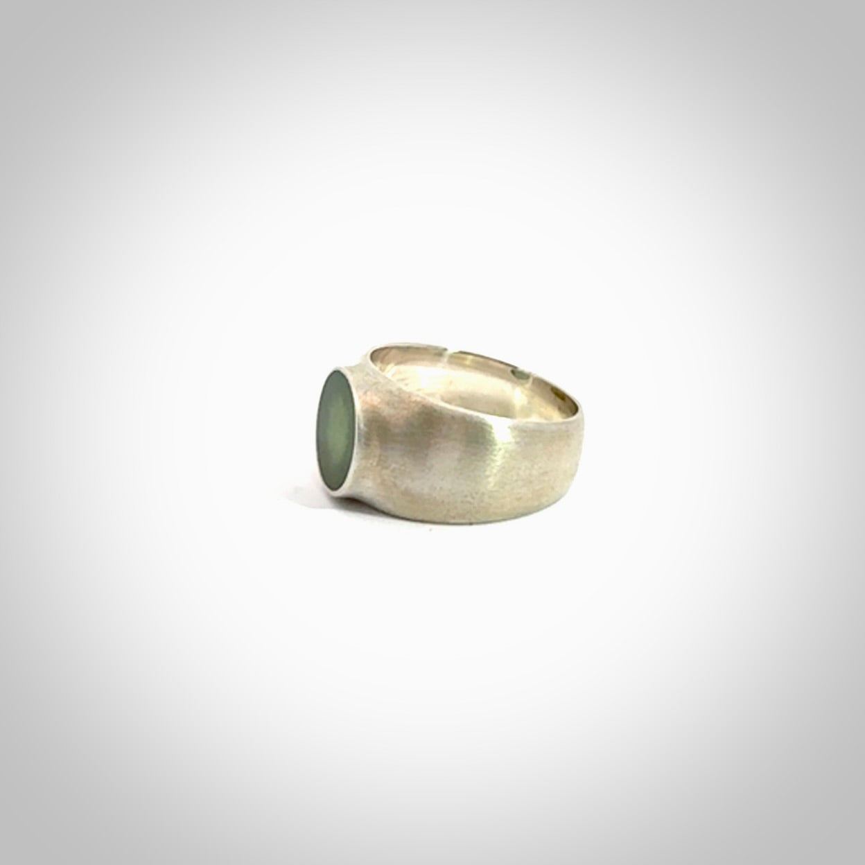 Hand carved jade band ring with sterling silver.
