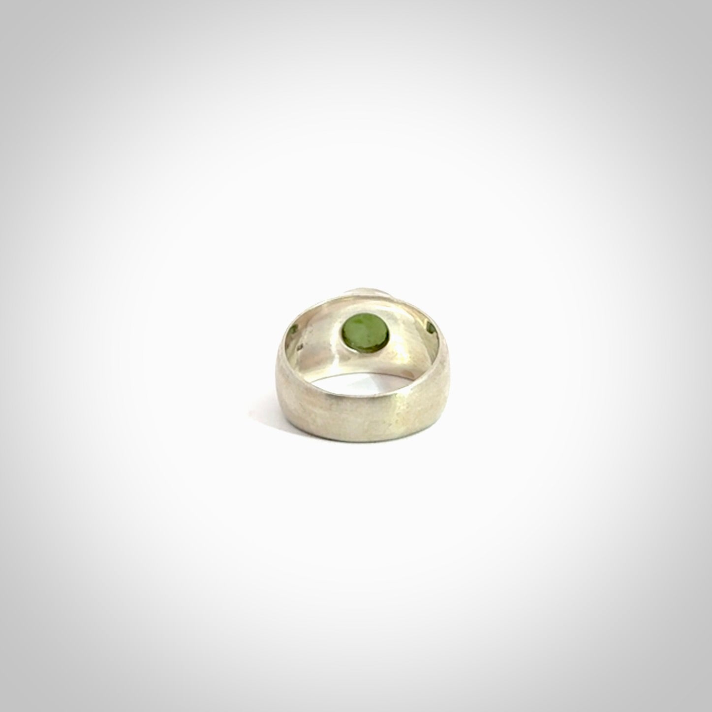 Hand carved jade band ring with sterling silver.