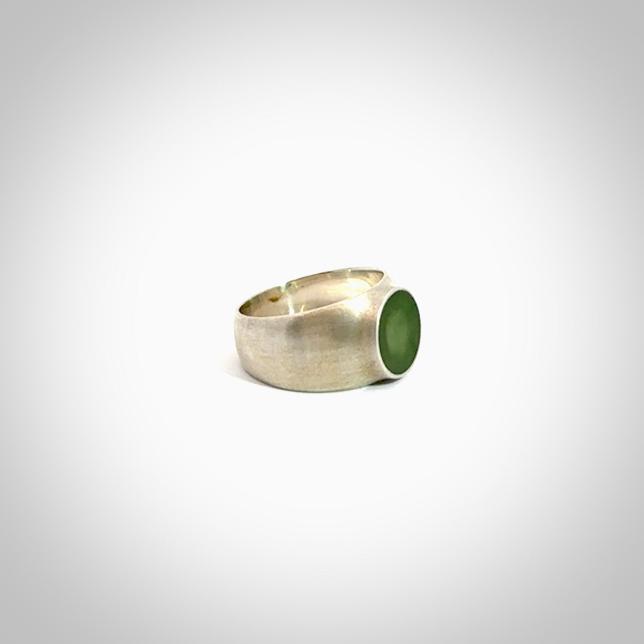 Hand carved jade band ring with sterling silver.