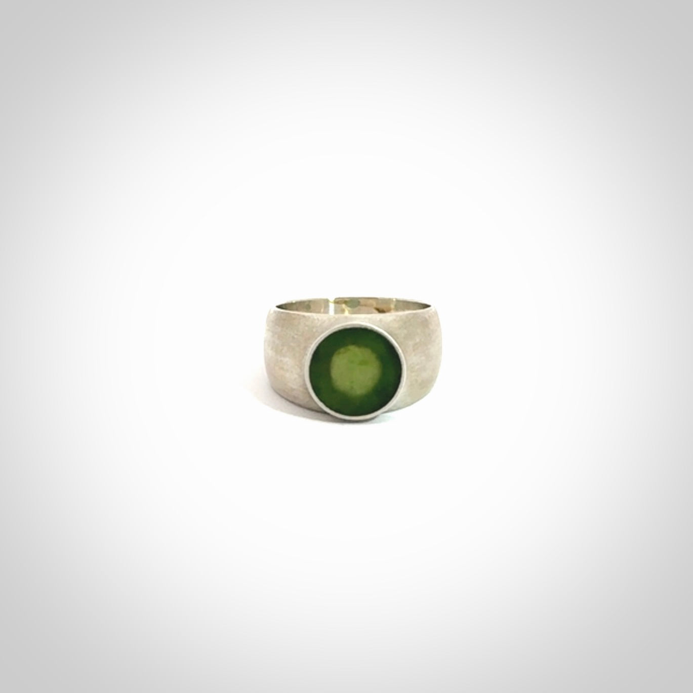 Hand carved jade band ring with sterling silver.