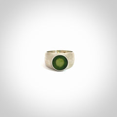 Hand carved jade band ring with sterling silver.