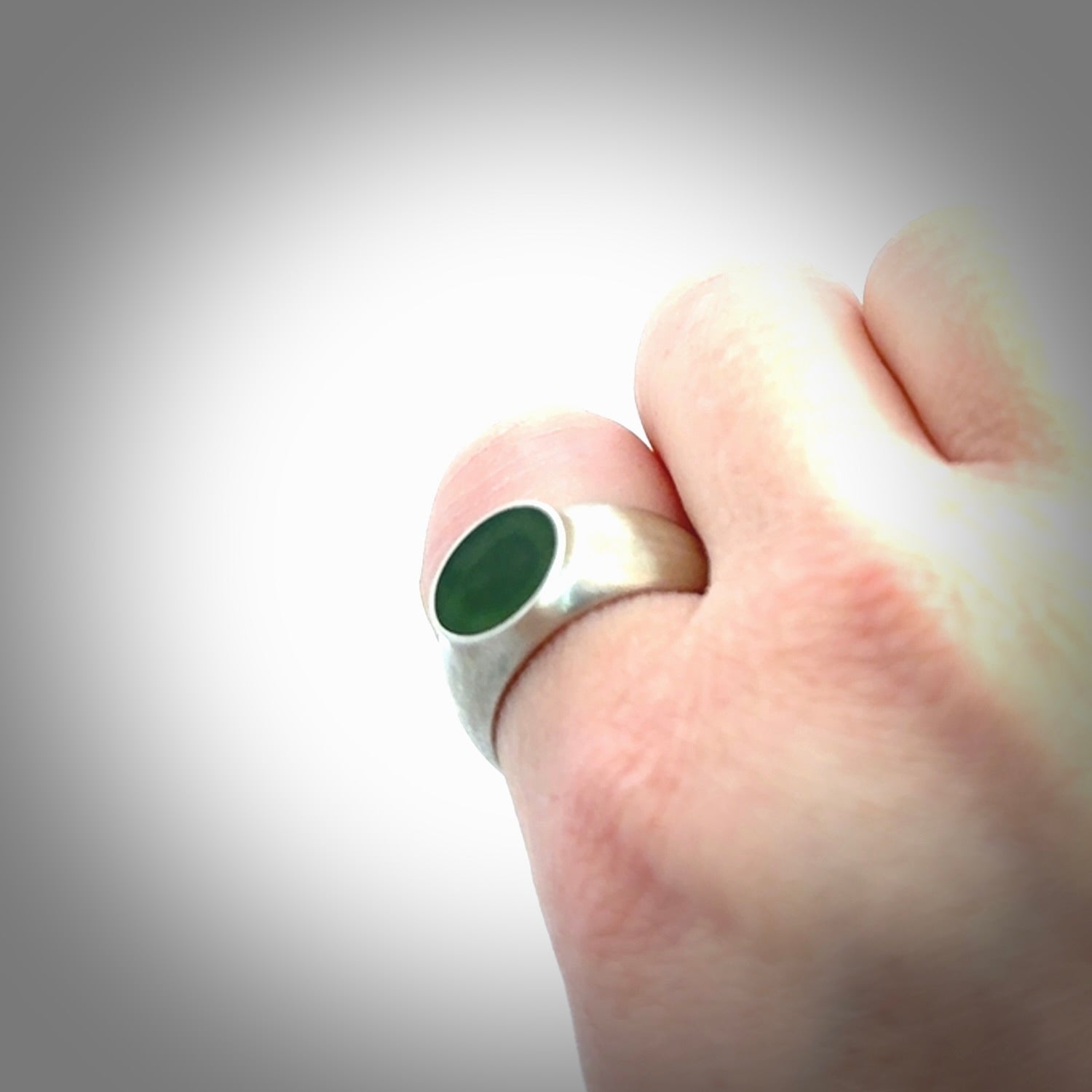 Hand carved jade band ring with sterling silver.