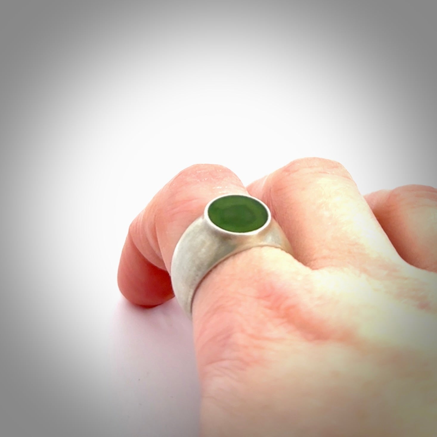 Hand carved jade band ring with sterling silver.