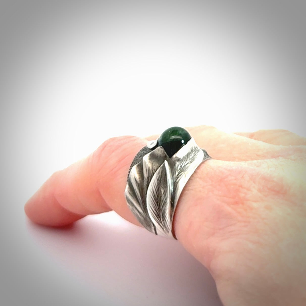 Hand carved jade band ring with sterling silver.