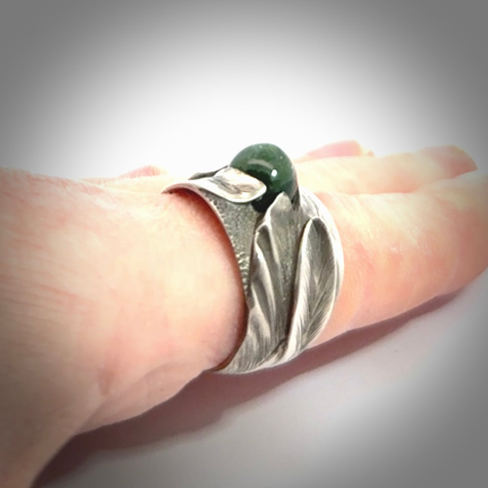 Hand carved jade band ring with sterling silver.