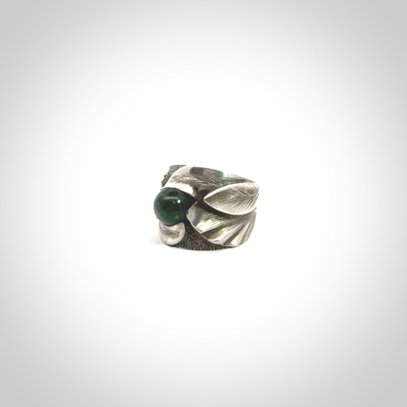 Hand carved jade band ring with sterling silver.