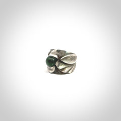 Hand carved jade band ring with sterling silver.