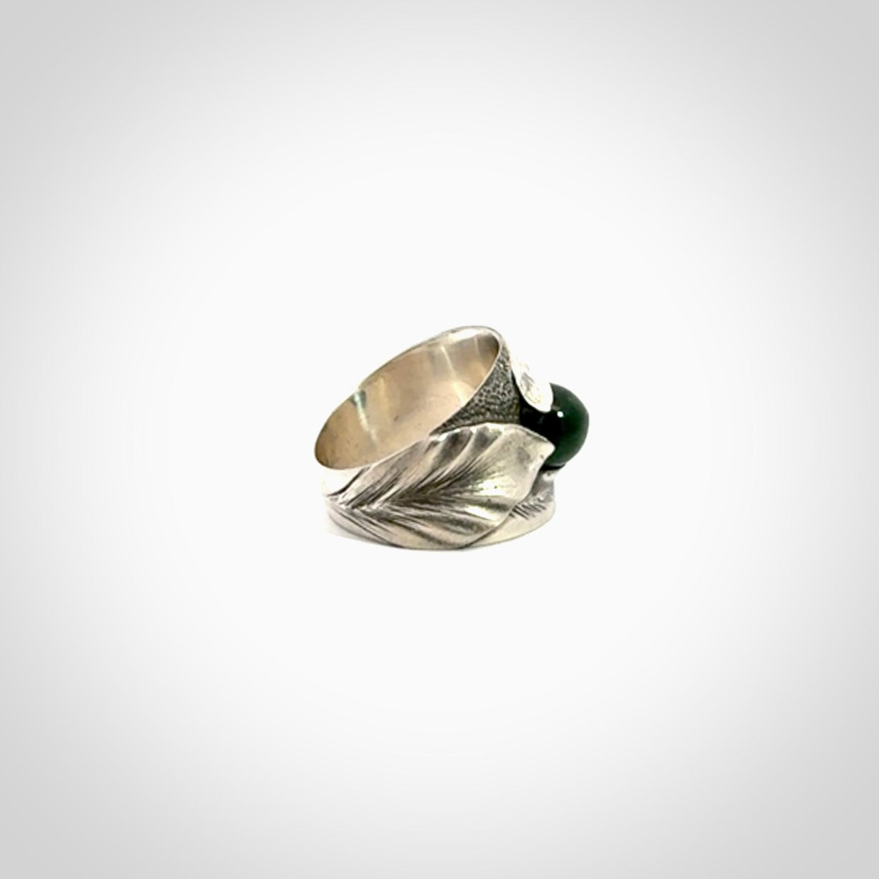 Hand carved jade band ring with sterling silver.