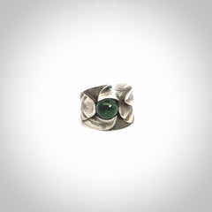Hand carved jade band ring with sterling silver.