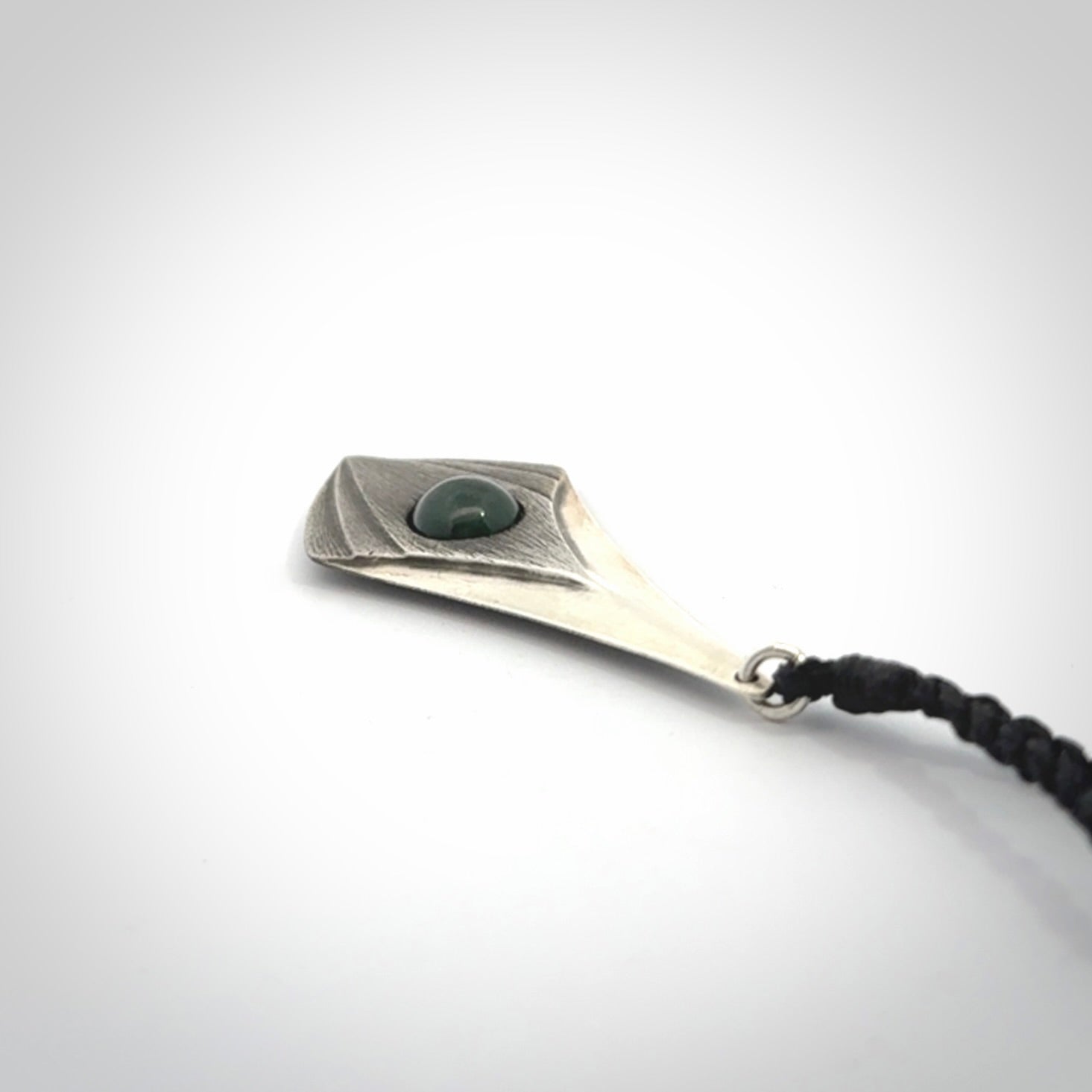 This is a hand carved Sterling Silver lantern drop pendant with New Zealand Jade insert. This is a medium sized necklace and is provided with an adjustable black cord.