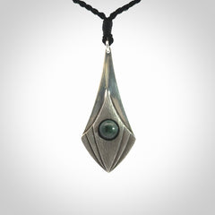 This is a hand carved Sterling Silver lantern drop pendant with New Zealand Jade insert. This is a medium sized necklace and is provided with an adjustable black cord.