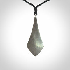 This is a hand carved Sterling Silver lantern drop pendant with New Zealand Jade insert. This is a medium sized necklace and is provided with an adjustable black cord.