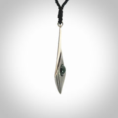 This is a hand carved Sterling Silver lantern drop pendant with New Zealand Jade insert. This is a medium sized necklace and is provided with an adjustable black cord.