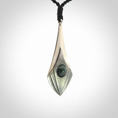 This is a hand carved Sterling Silver lantern drop pendant with New Zealand Jade insert. This is a medium sized necklace and is provided with an adjustable black cord.