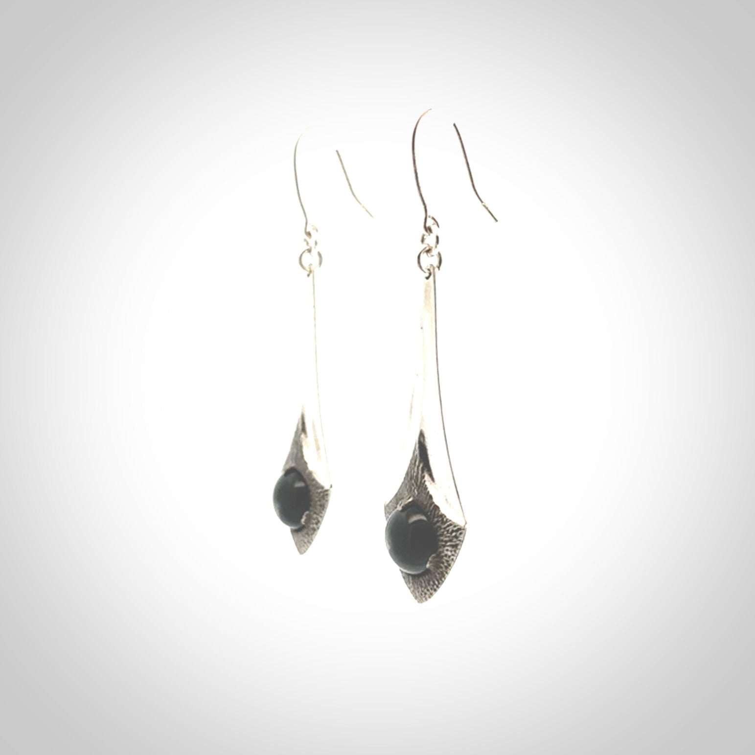 These are hand carved Sterling Silver lantern earrings with New Zealand Jade insert.