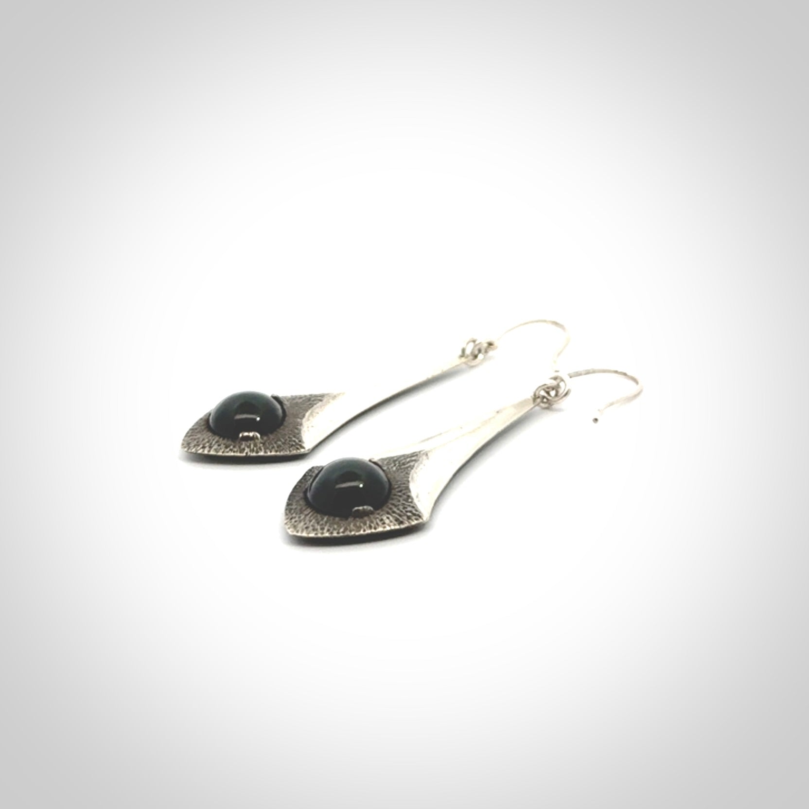 These are hand carved Sterling Silver lantern earrings with New Zealand Jade insert.
