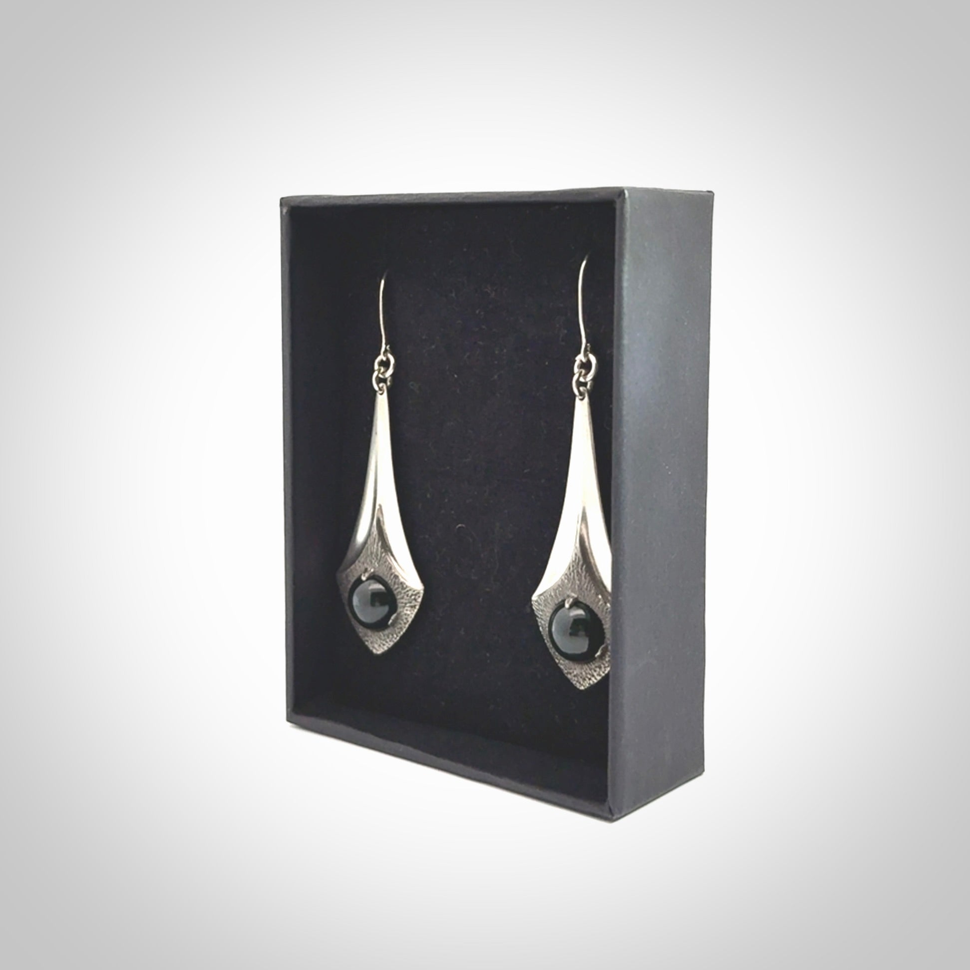 These are hand carved Sterling Silver lantern earrings with New Zealand Jade insert.