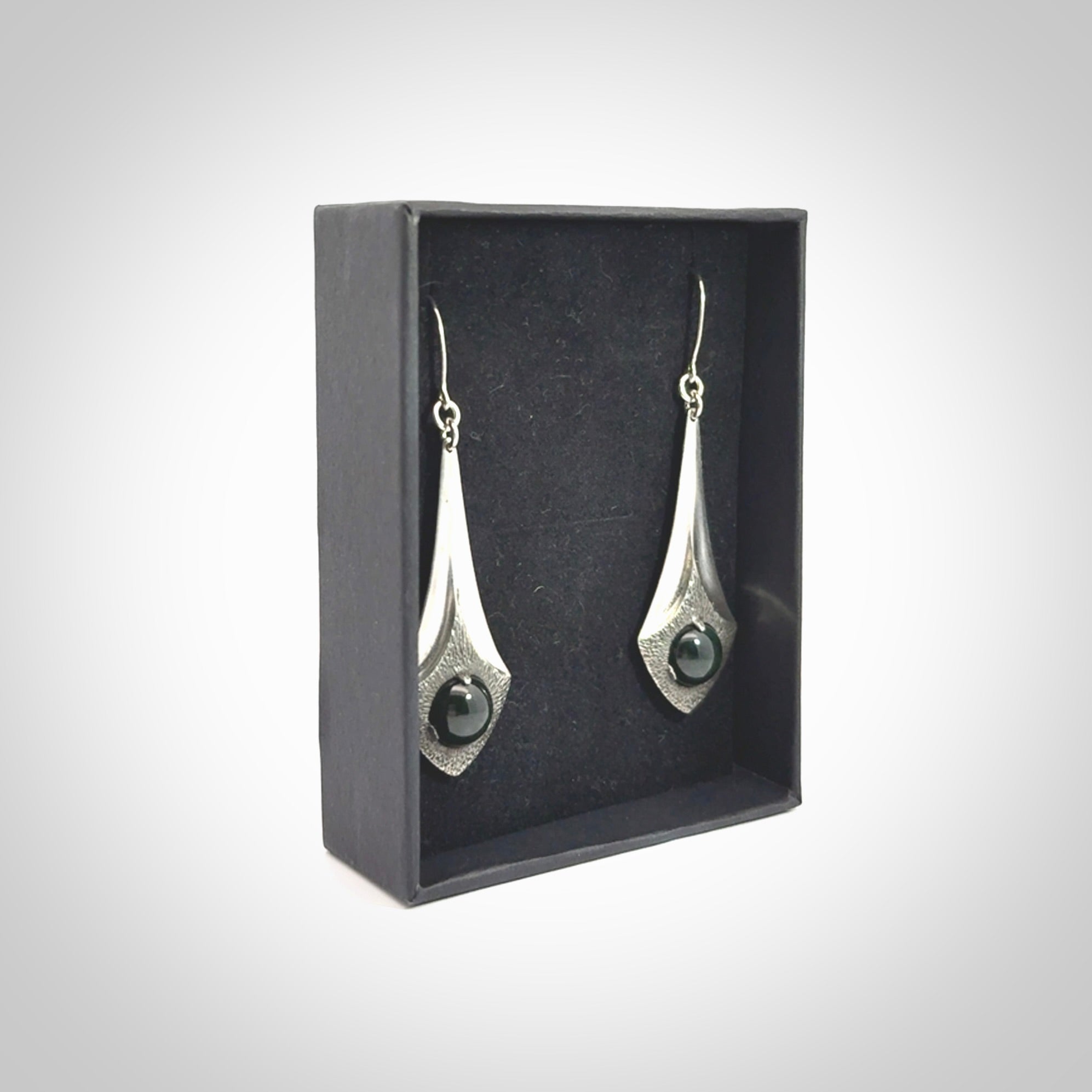 These are hand carved Sterling Silver lantern earrings with New Zealand Jade insert.