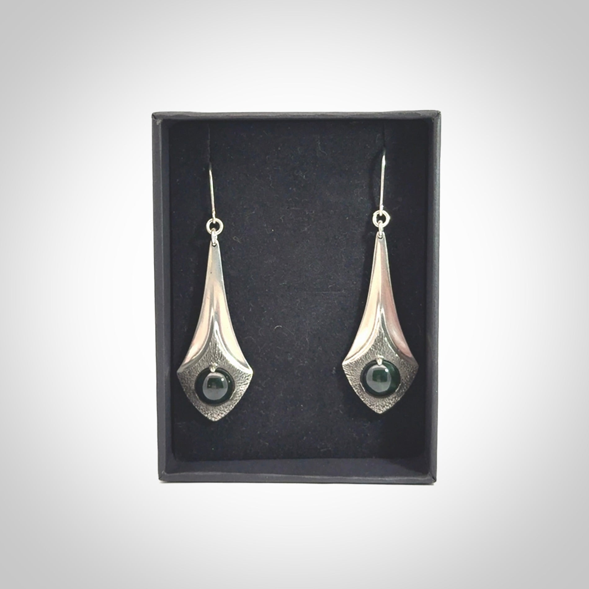 These are hand carved Sterling Silver lantern earrings with New Zealand Jade insert.