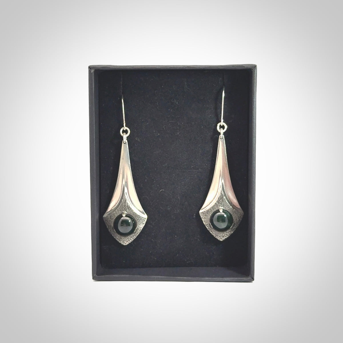 These are hand carved Sterling Silver lantern earrings with New Zealand Jade insert.