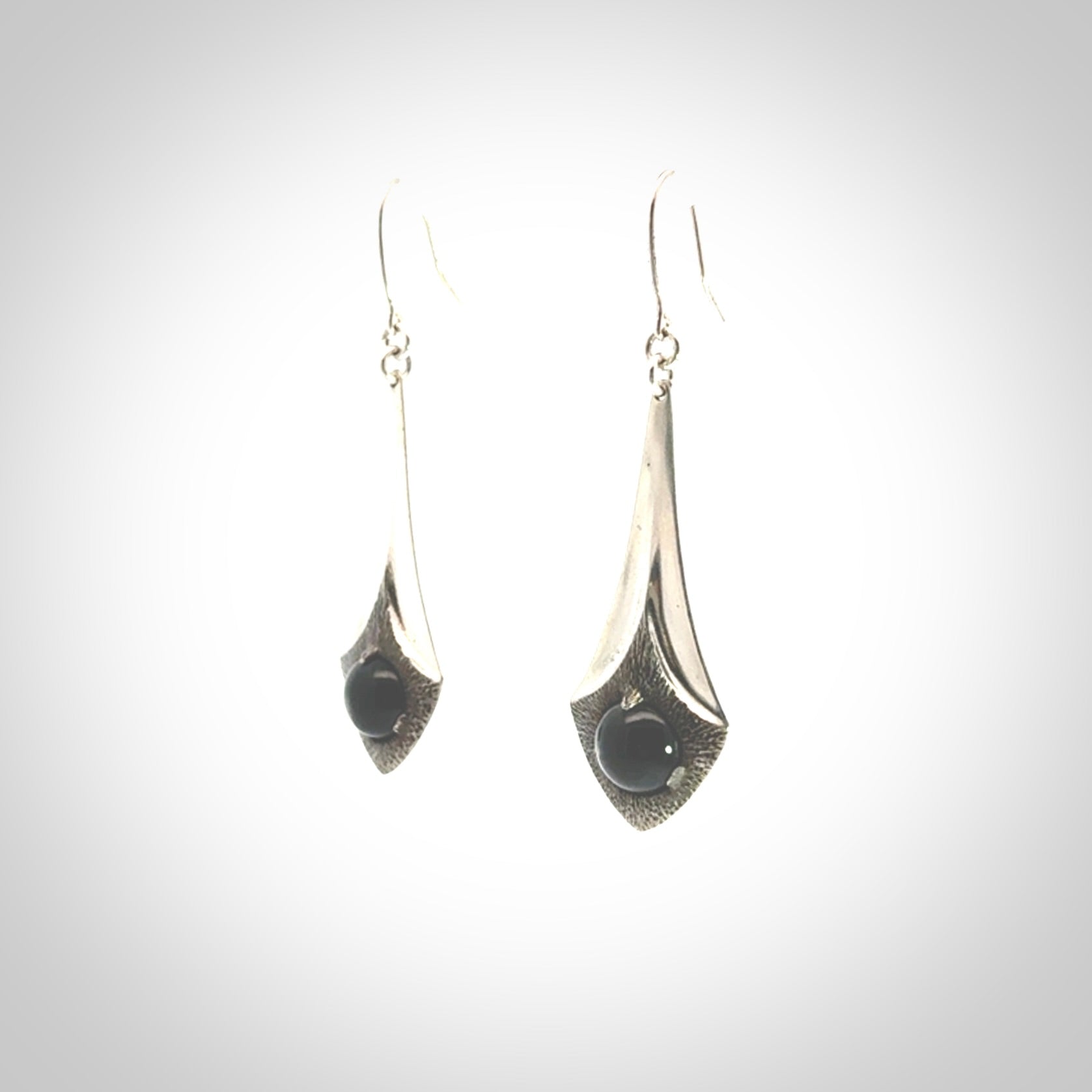 These are hand carved Sterling Silver lantern earrings with New Zealand Jade insert.