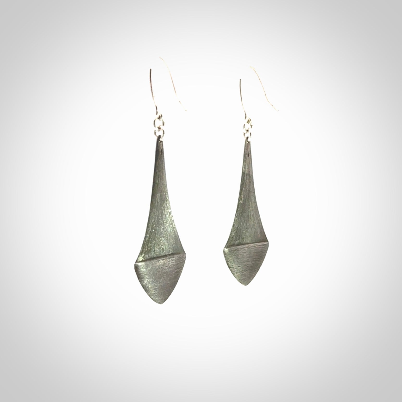 These are hand carved Sterling Silver lantern earrings with New Zealand Jade insert.