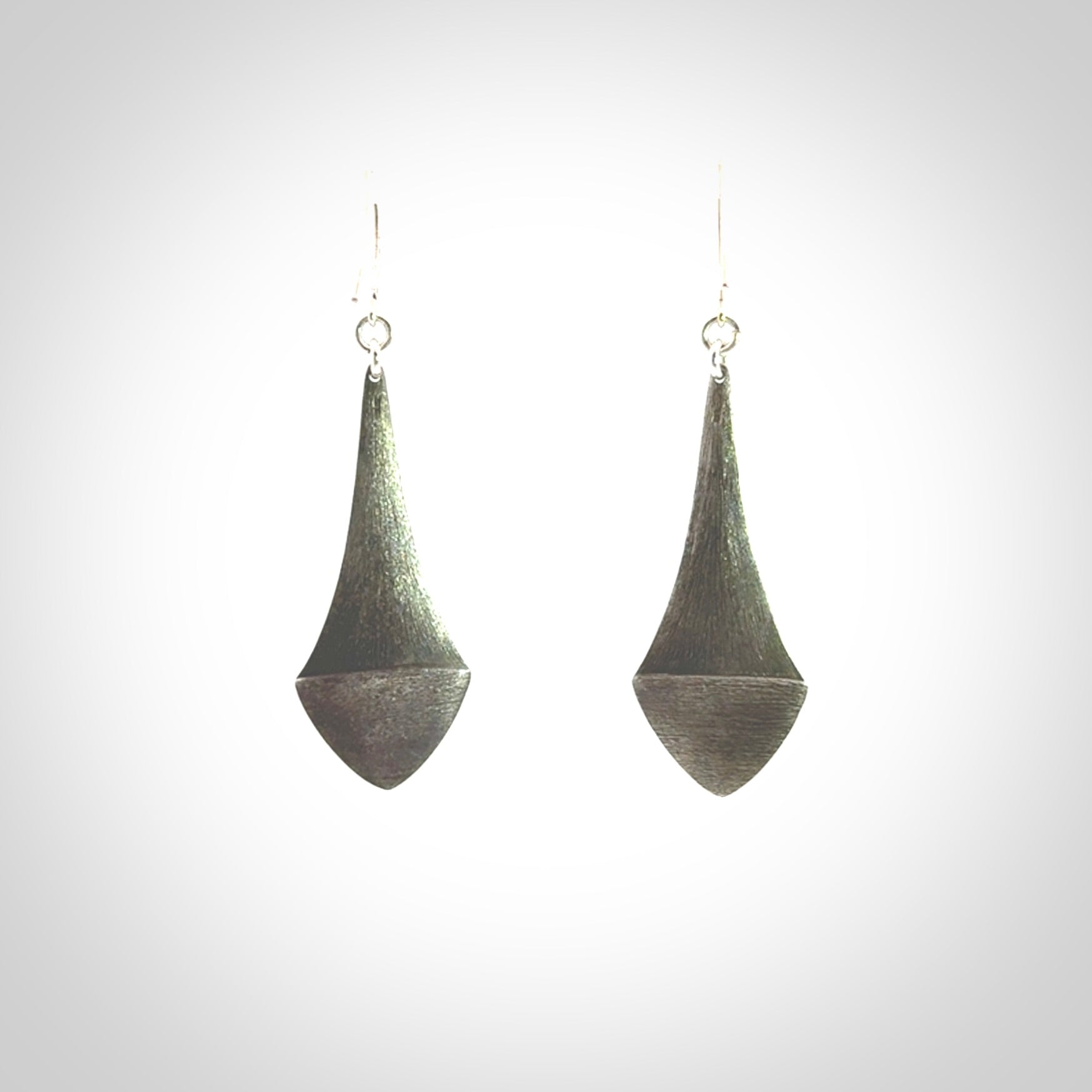 These are hand carved Sterling Silver lantern earrings with New Zealand Jade insert.