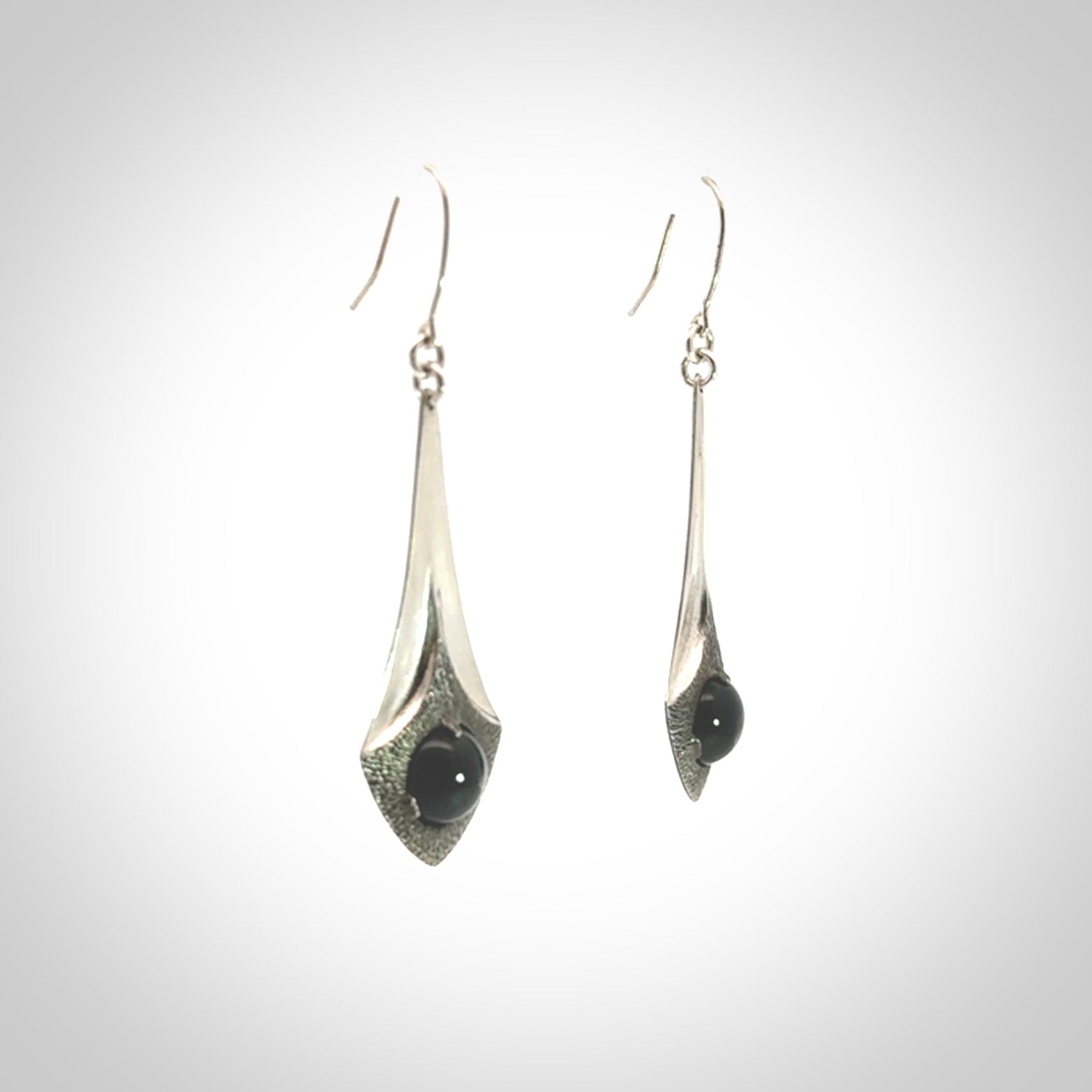 These are hand carved Sterling Silver lantern earrings with New Zealand Jade insert.