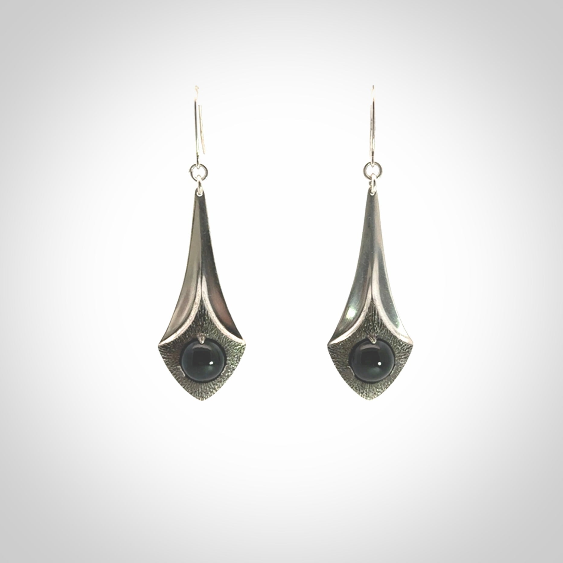 These are hand carved Sterling Silver lantern earrings with New Zealand Jade insert.
