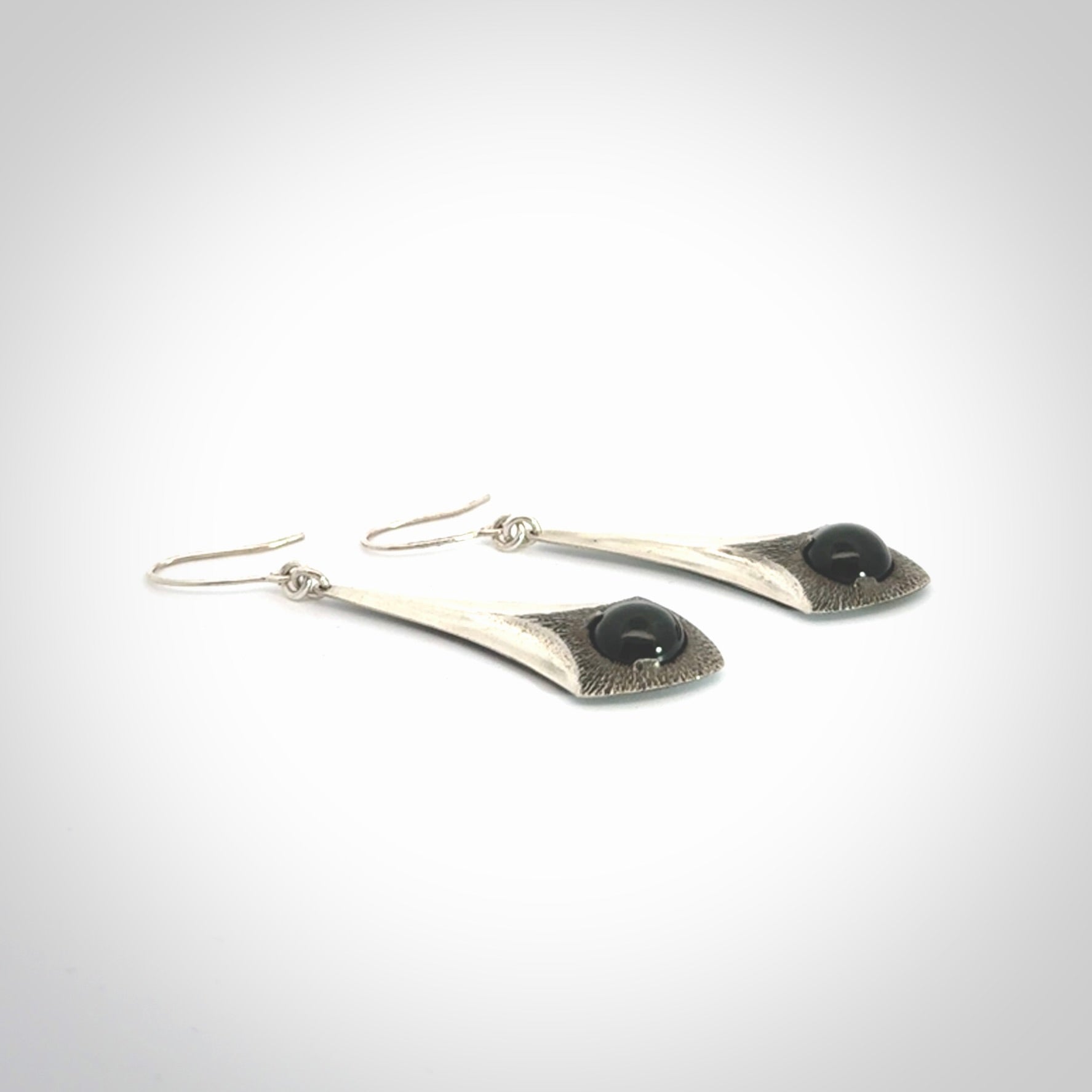 These are hand carved Sterling Silver lantern earrings with New Zealand Jade insert.