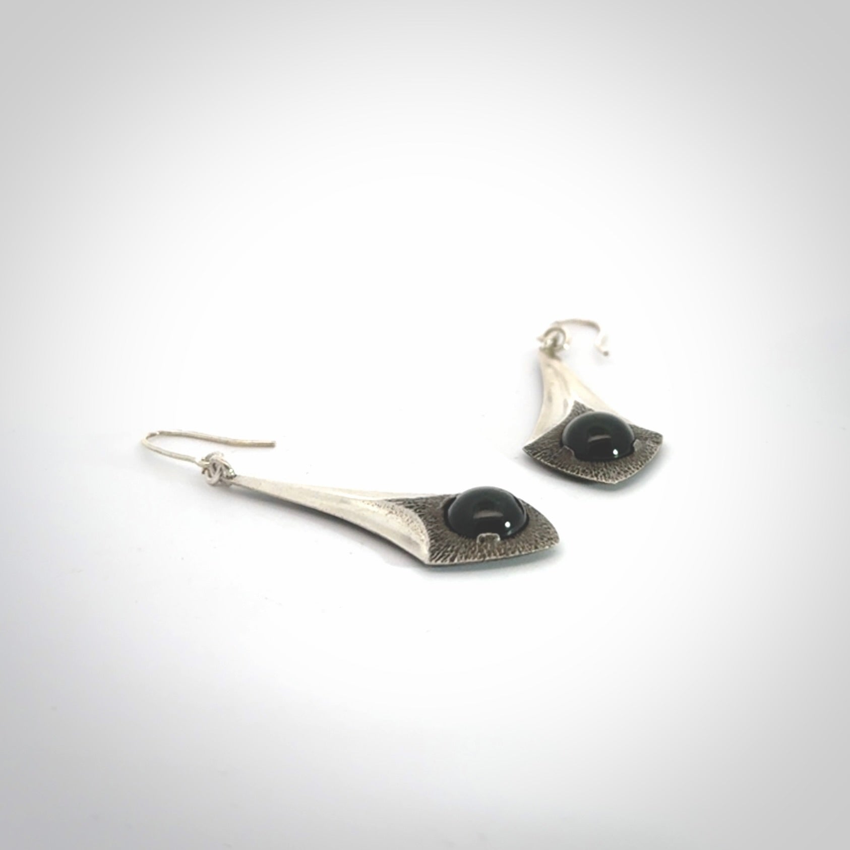 These are hand carved Sterling Silver lantern earrings with New Zealand Jade insert.