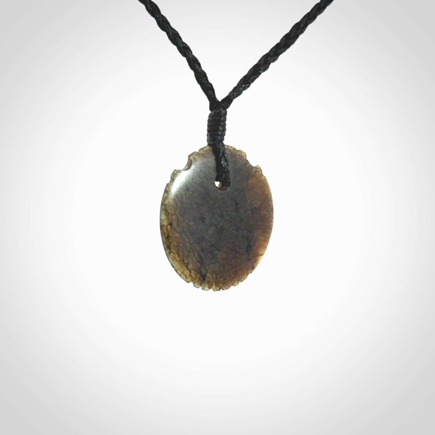 Subtle yet Striking Art to Wear! Hand carved New Zealand Jade pendant
