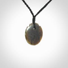 Subtle yet Striking Art to Wear! Hand carved New Zealand Jade pendant