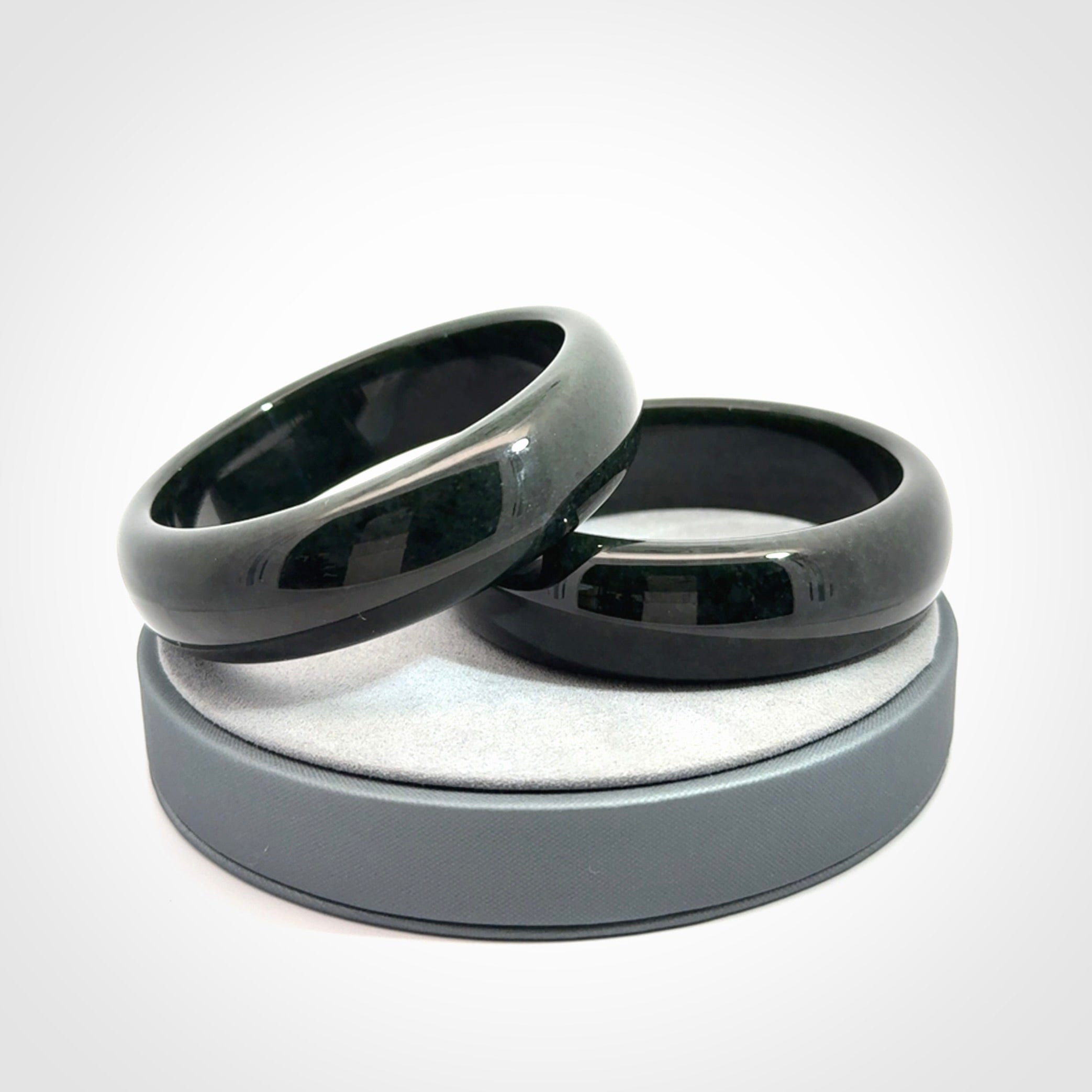 Hand carved black jade bangle. Carved from black jade. This is a solid jade bangle carved from a single piece of jade. It is polished to a soft shine. The jade is otherwise untreated and completely natural.