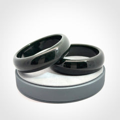 Hand carved black jade bangle. Carved from black jade. This is a solid jade bangle carved from a single piece of jade. It is polished to a soft shine. The jade is otherwise untreated and completely natural.