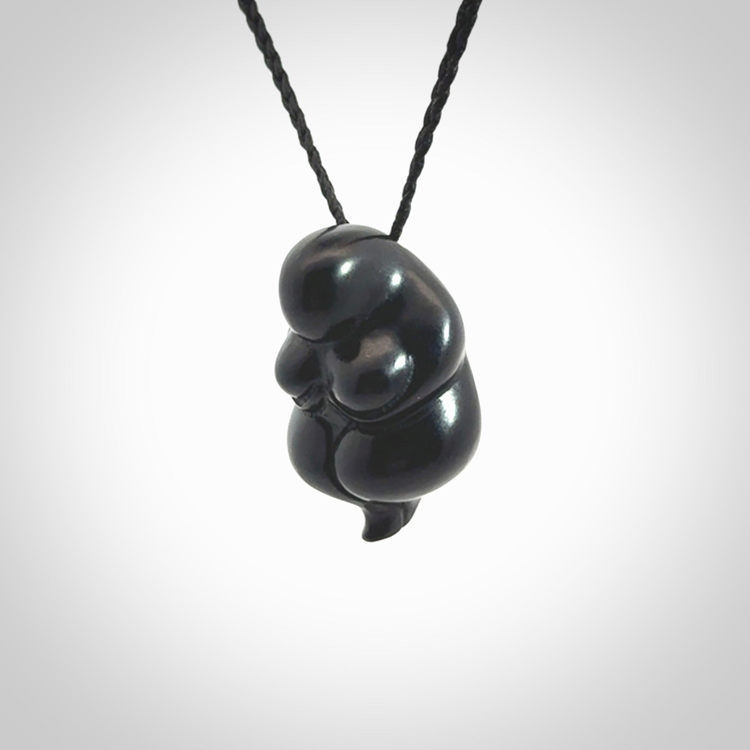 Black jade goddess pendant. Hand carved by NZ Pacific. Black Jade jewellery for sale online. Midnight Goddess is provided on a black adjustable cord and packaged in a woven kete pouch.