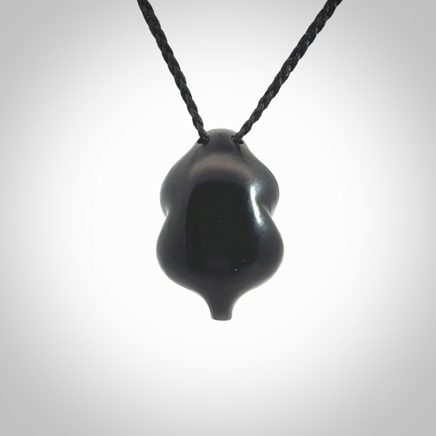Black jade goddess pendant. Hand carved by NZ Pacific. Black Jade jewellery for sale online. Midnight Goddess is provided on a black adjustable cord and packaged in a woven kete pouch.