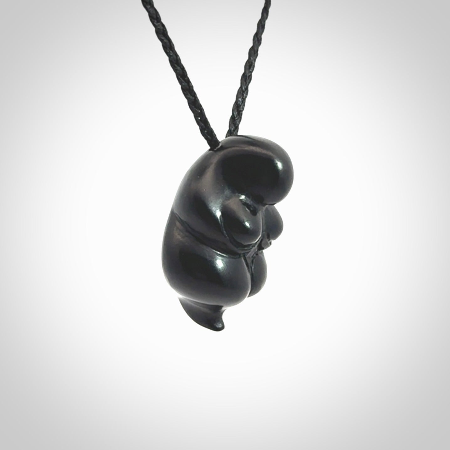 Black jade goddess pendant. Hand carved by NZ Pacific. Black Jade jewellery for sale online. Midnight Goddess is provided on a black adjustable cord and packaged in a woven kete pouch.