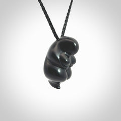 Black jade goddess pendant. Hand carved by NZ Pacific. Black Jade jewellery for sale online. Midnight Goddess is provided on a black adjustable cord and packaged in a woven kete pouch.