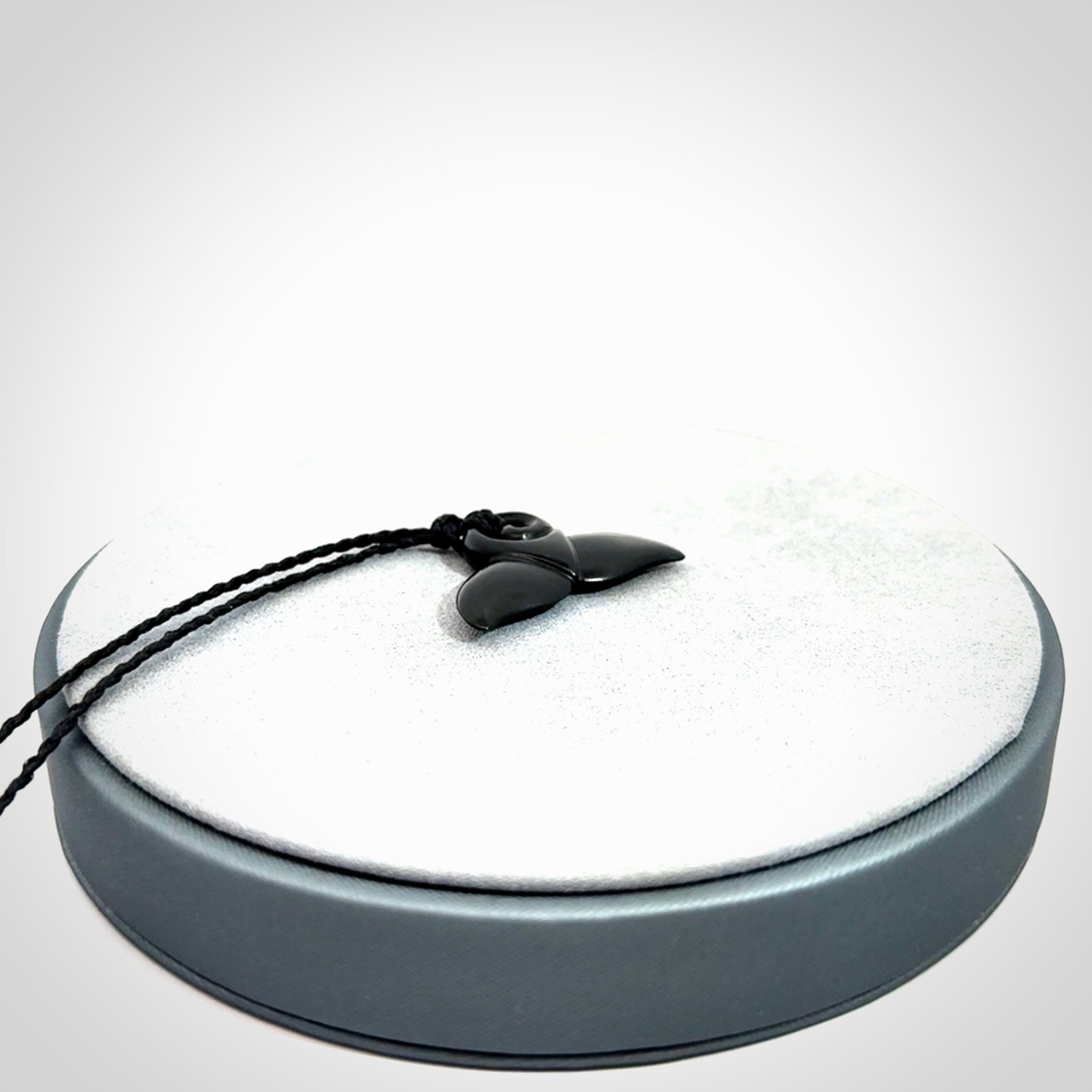 Hand carved Australian Black Jade whale tail pendant. Small whale tail necklace with adjustable cord.