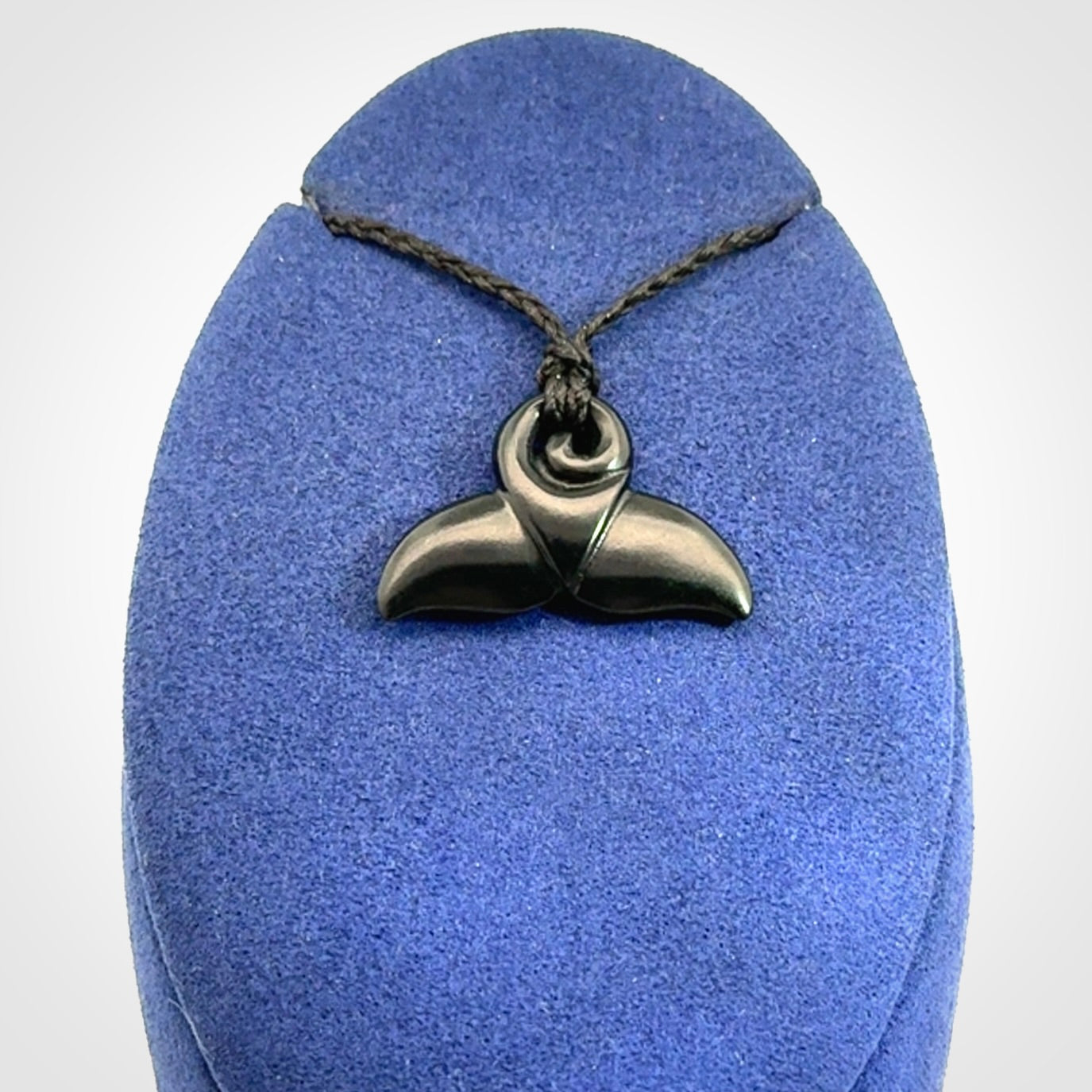 Hand carved Australian Black Jade whale tail pendant. Small whale tail necklace with adjustable cord.