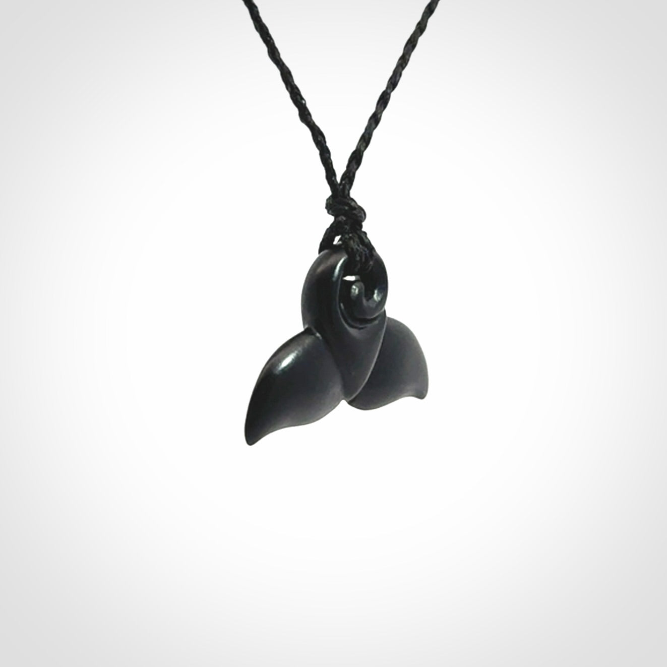 Hand carved Australian Black Jade whale tail pendant. Small whale tail necklace with adjustable cord.