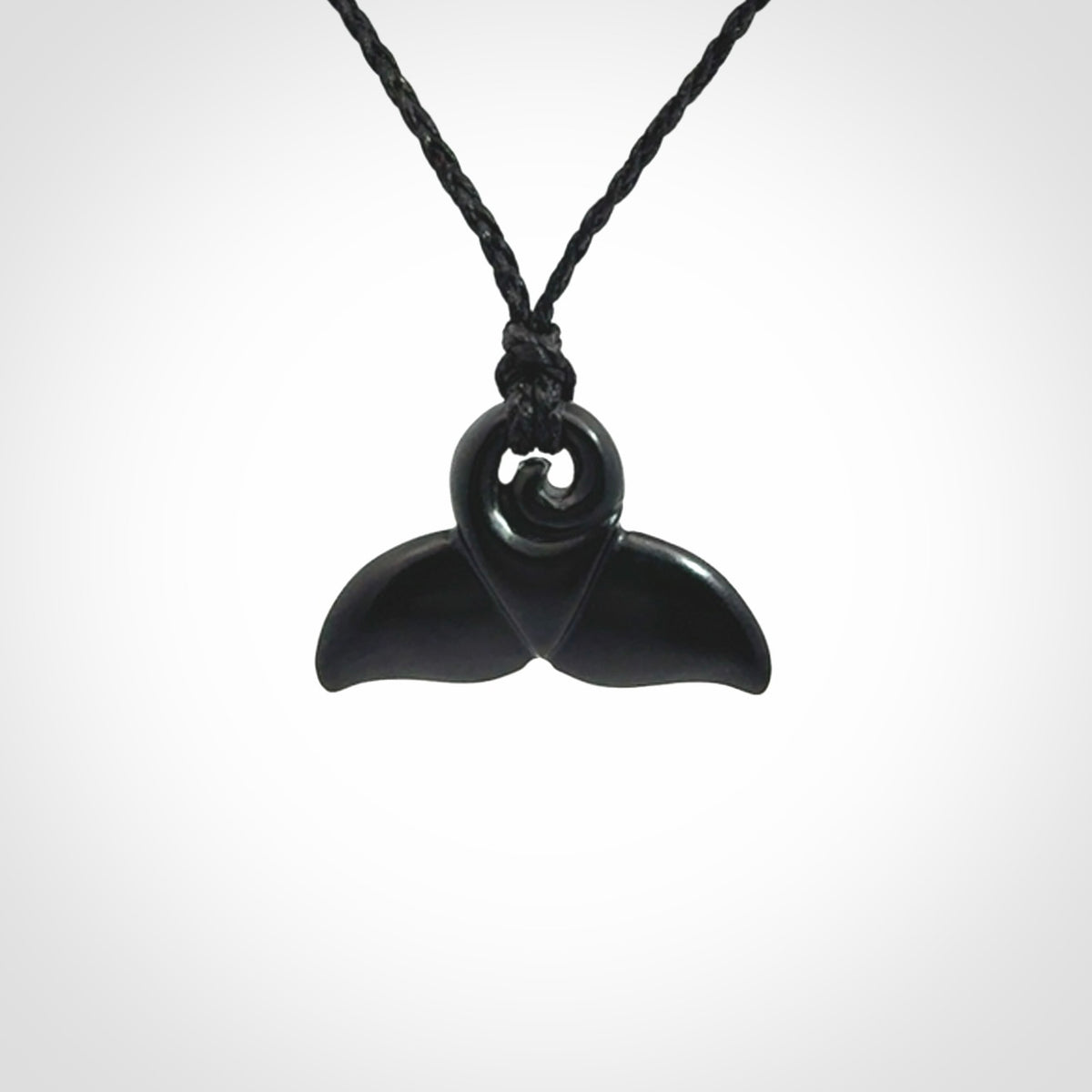 Hand carved Australian Black Jade whale tail pendant. Small whale tail necklace with adjustable cord.