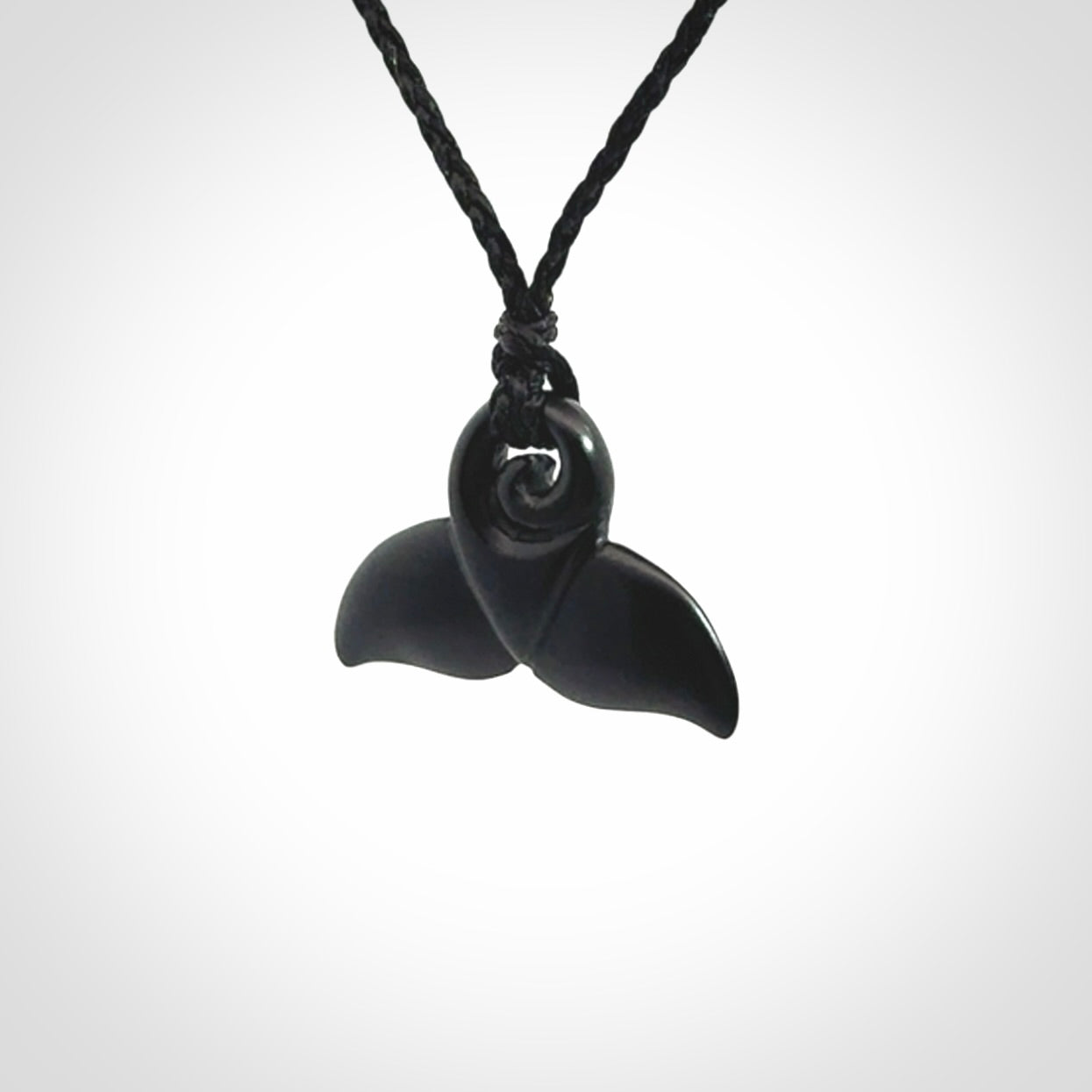 Hand carved Australian Black Jade whale tail pendant. Small whale tail necklace with adjustable cord.