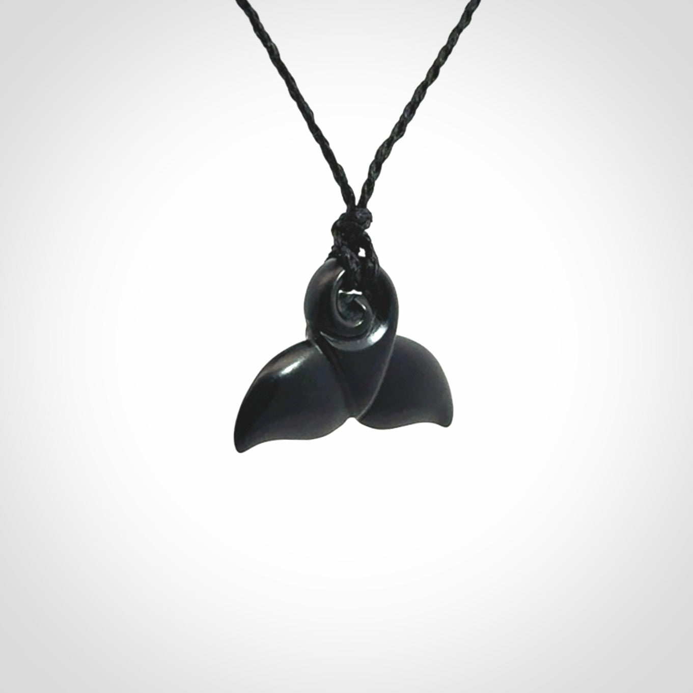 Hand carved Australian Black Jade whale tail pendant. Small whale tail necklace with adjustable cord.